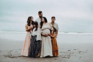 mom surrounded by her kids and husband during session with Oregon Coast Photographer