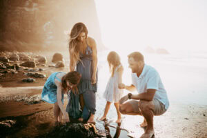 family of four being photographed at Cannon beach by Oregon Family Photographer