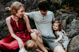 family of four laughing during family portrait session in Portland