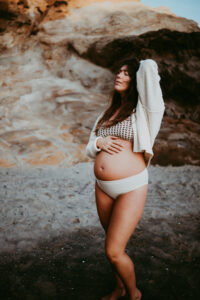 pregnant woman posing for banks family, maternity and newborn photographer
