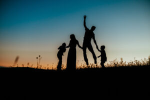 silhouette picture of family of 4