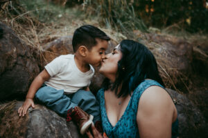 mom kissing toddler