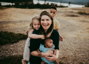 family of four posing for family photos with portland family photographer