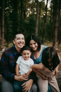 family of four posing for family photos with portland family photographer