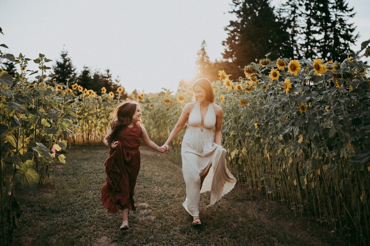 mother and daughter at sunflower field