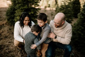 family at Christmas tree farm in Portland