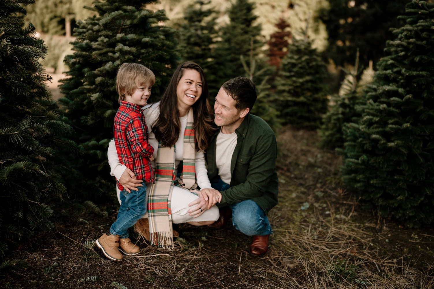 family of three at Christmas tree farms in Portland