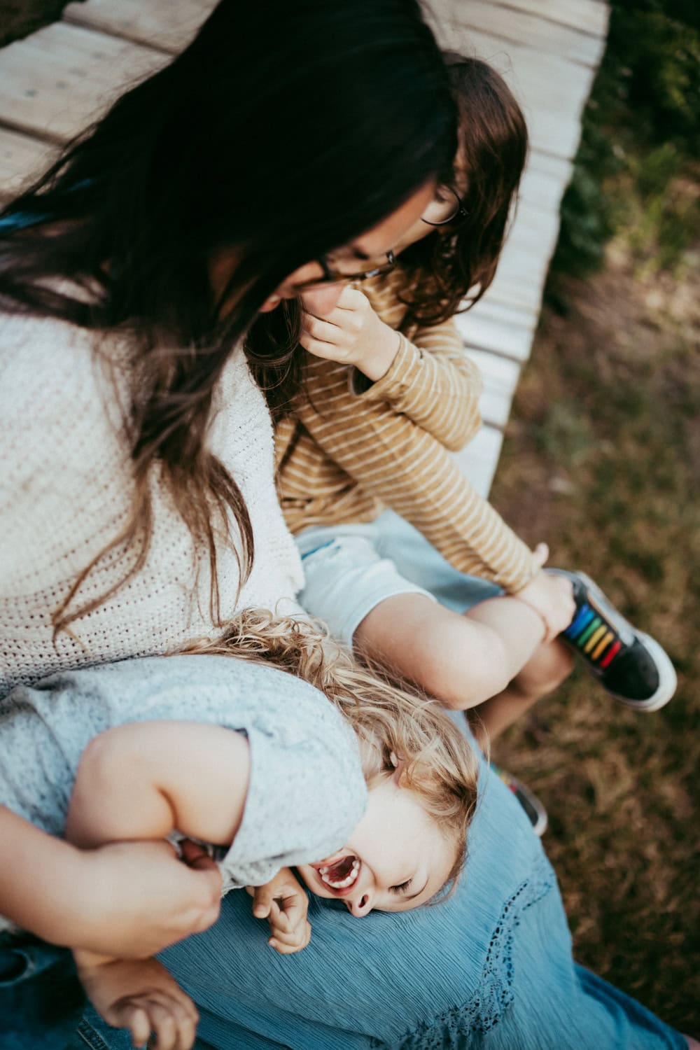 mother making son laugh during family photos at Mt Rainier