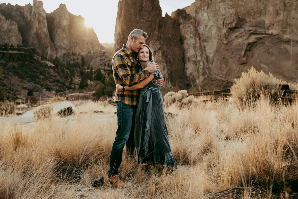 couple embracing during Smith Rock family photos