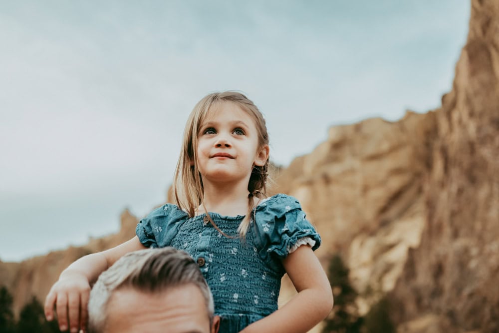 girl on father's shoulder during smith rock family photos