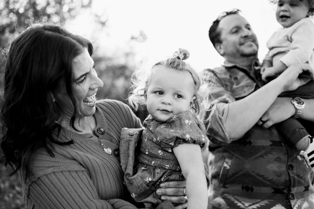 family of four photographed in black and white