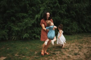 mom playing with daughters
