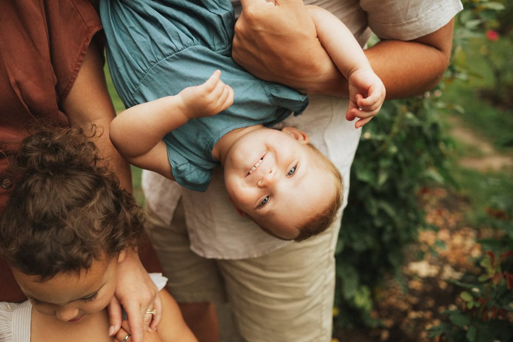 toddler playing with dad at the international rose test garden